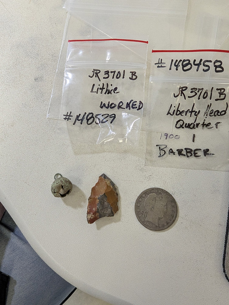 A button, a lithic, and a Barber quarter found in post-1861 fill south of the Memorial Church. Volunteers sorted and cleaned these artifacts this month.